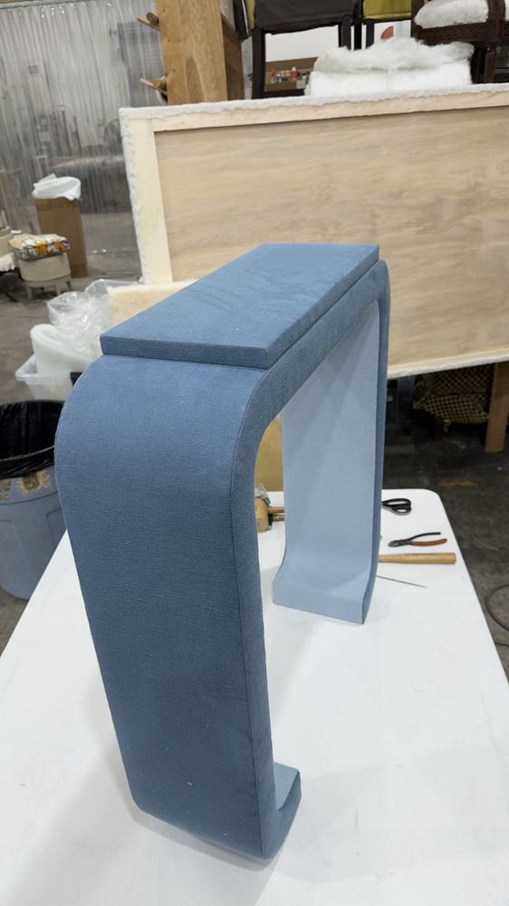 Hand-built blue waterfall bench in the Sarasota workshop