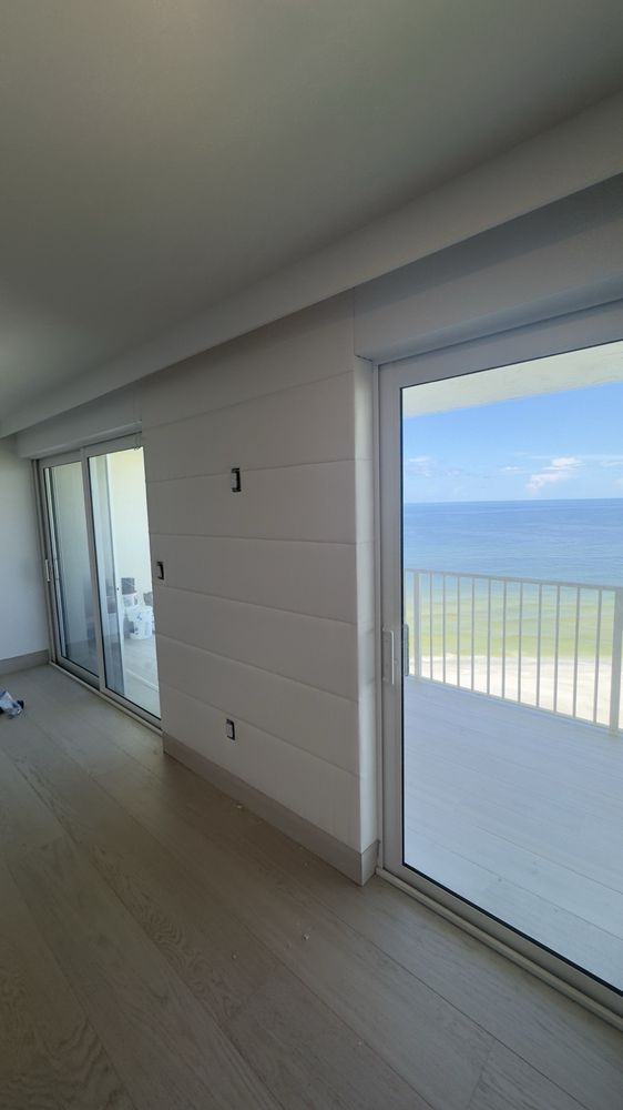 Beachfront condo with custom upholstered wall panels and Gulf view